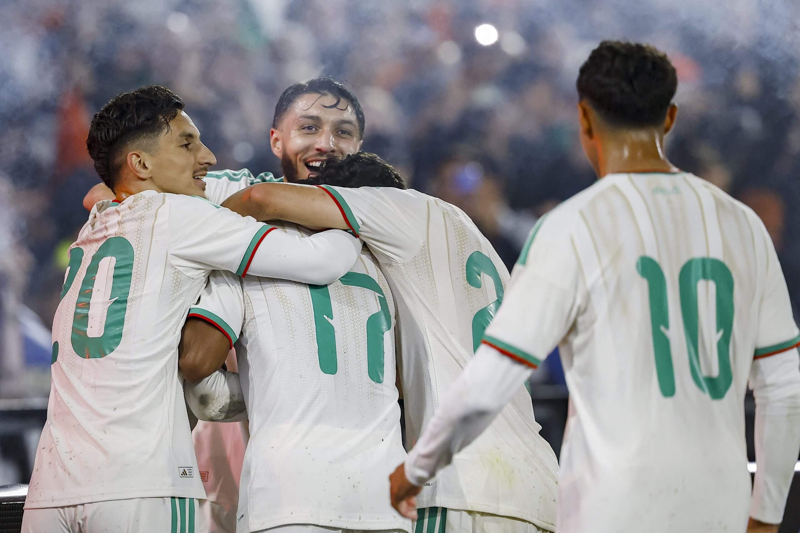 Algeria's players celebrate their winning goal