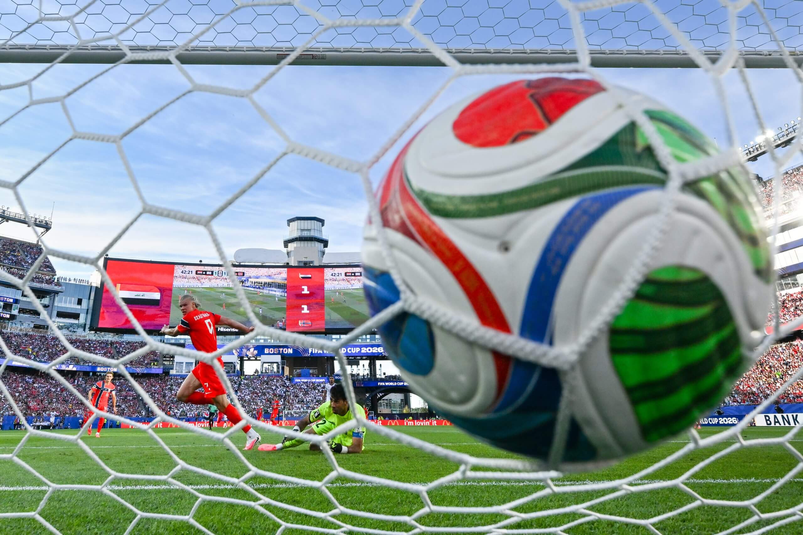 A close up of the ball in the net as Erling Haaland scores against Iraq