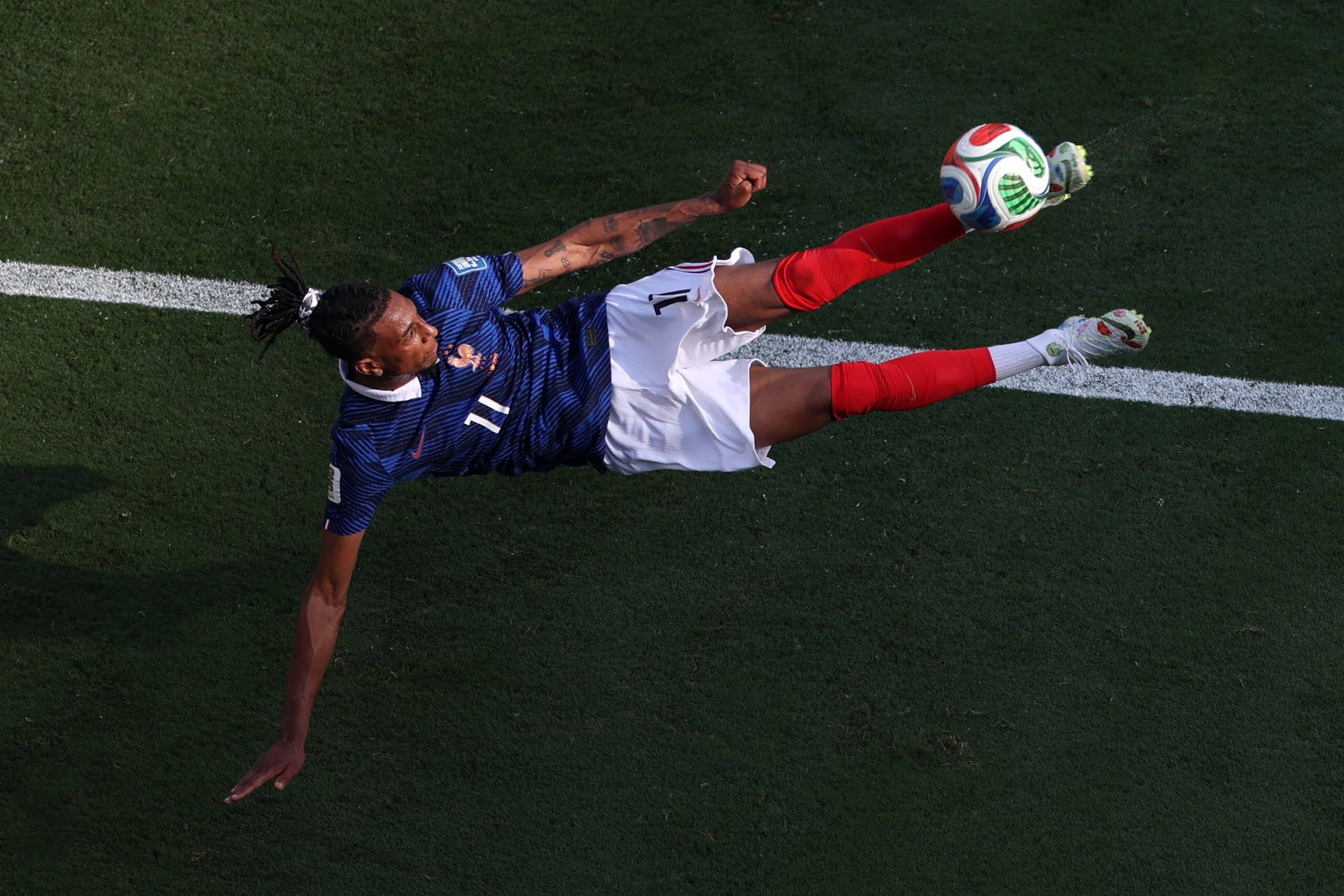 Michael Olise attempts his overhead kick against Sweden