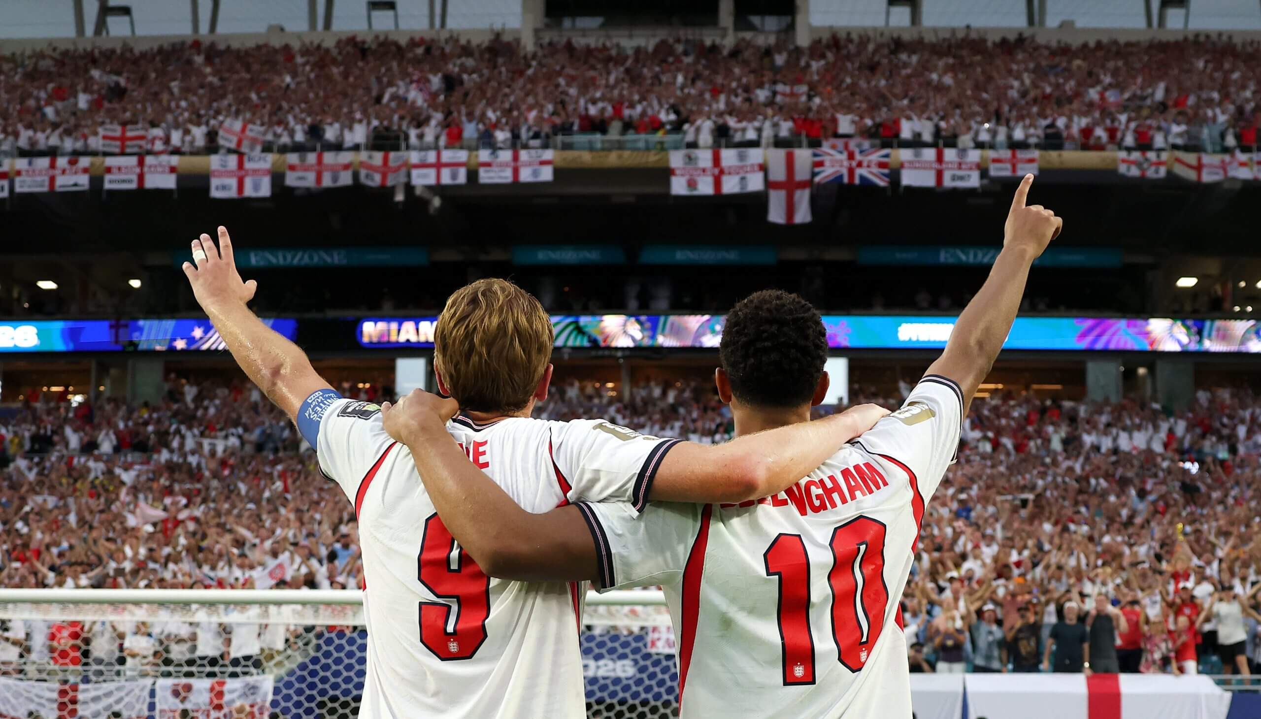 Harry Kane and Jude Bellingham, one arm each aloft, direct the England fans through a post-match rendition of Wonderwall in Miami