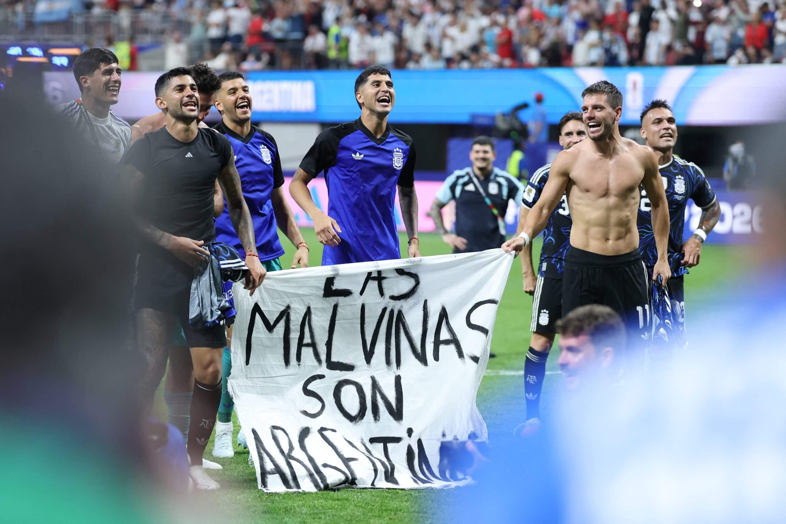 Argentina's players hold their 'The Falklands are Argentina's' banner