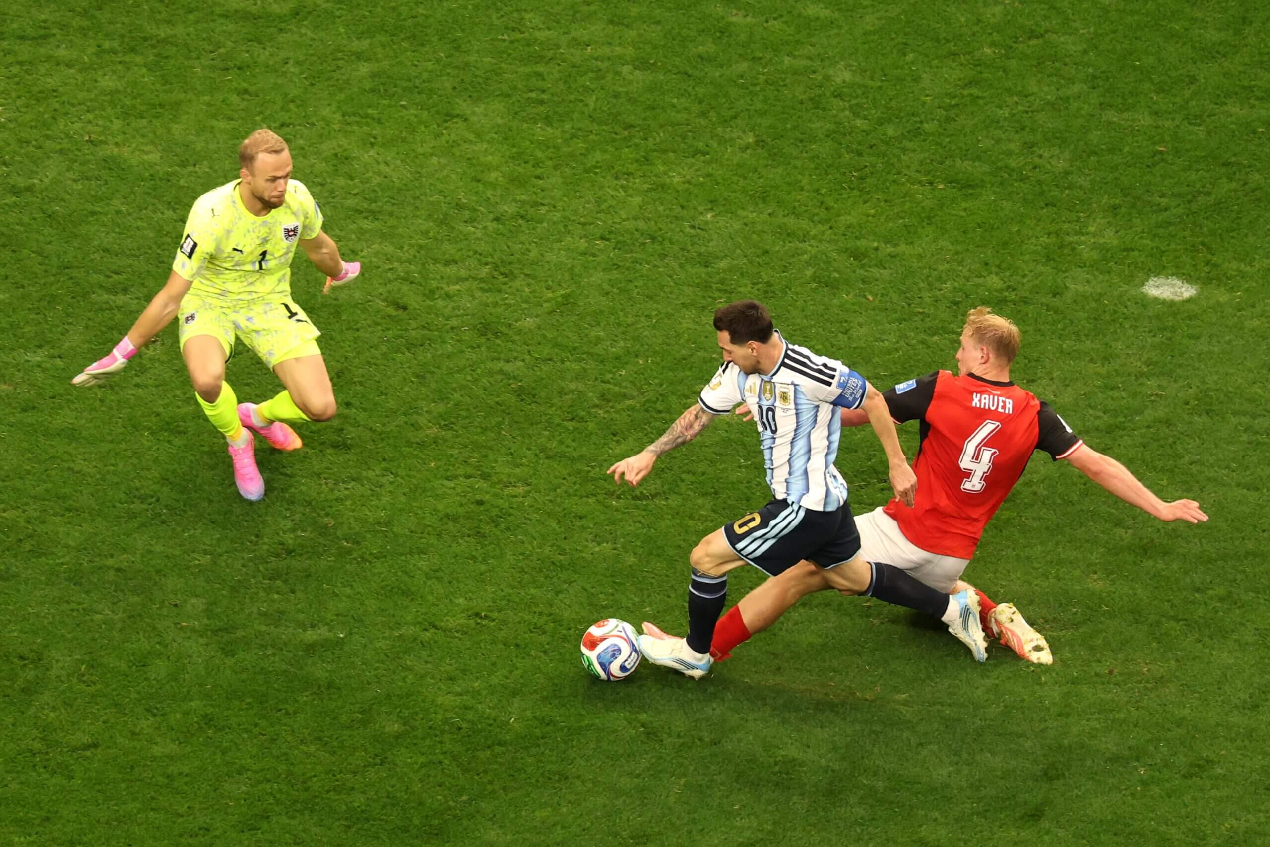 Xaver Schlager lunges and fouls Lionel Messi during Austria's 2-0 loss to Argentina at the World Cup