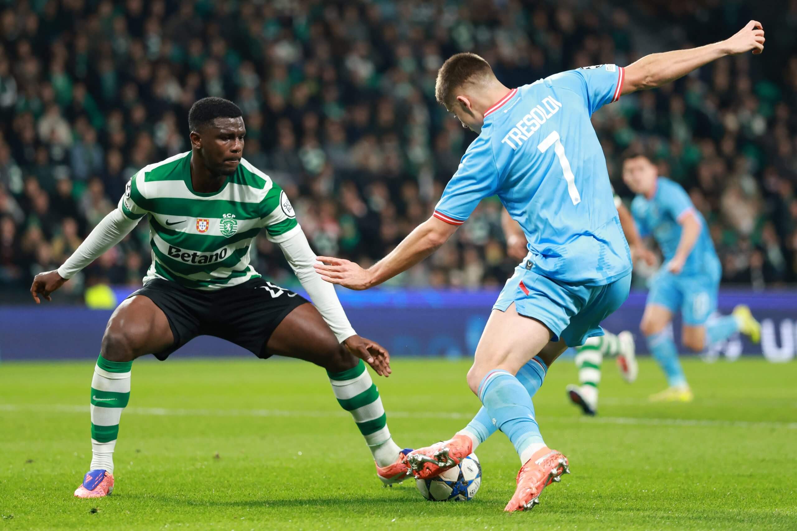 Ousmane Diomande keeps a close eye on Club Brugge's Nicolo Tresoldi during a Champions League game in 2025