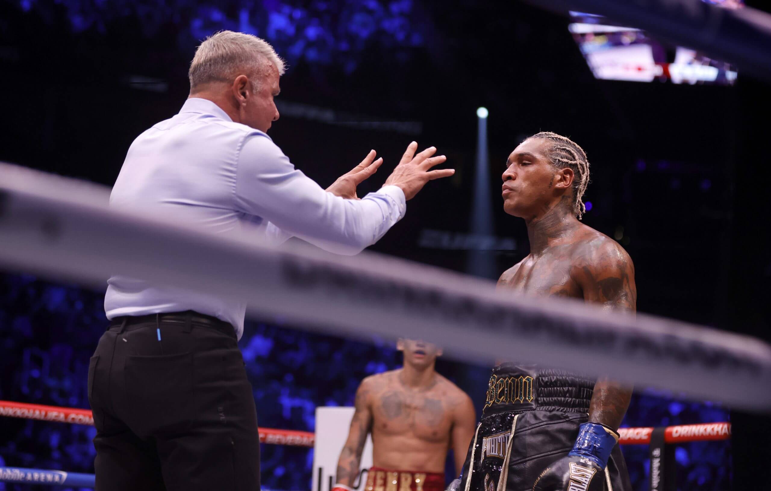Referee Thomas Taylor gives a count to Conor Benn after he was knocked down by Ryan Garcia. 