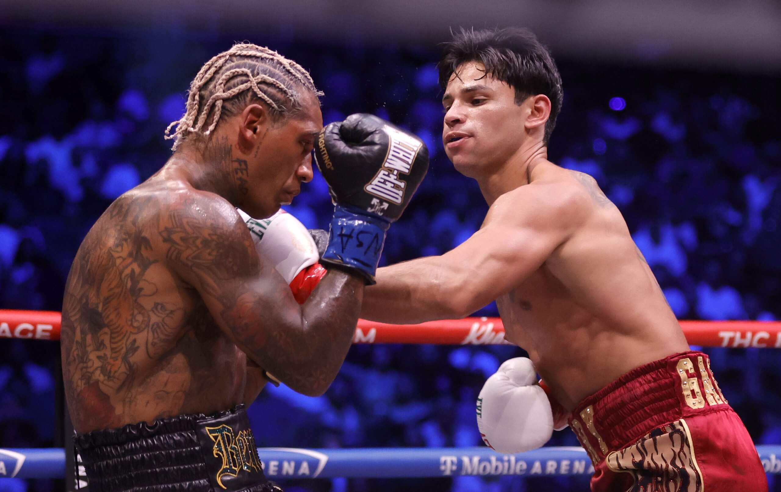 Ryan Garcia (R) punches Conor Benn in the second round 